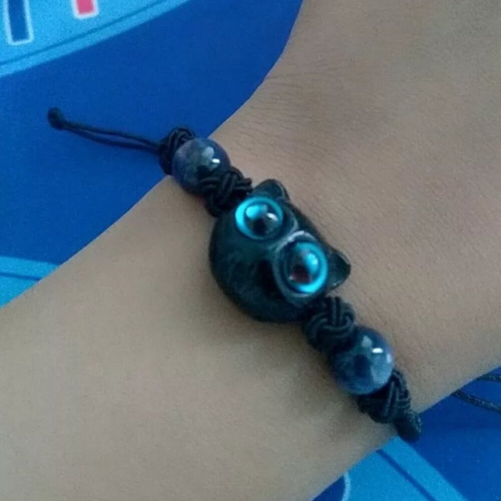 Black cat bracelet with yellow eyes
